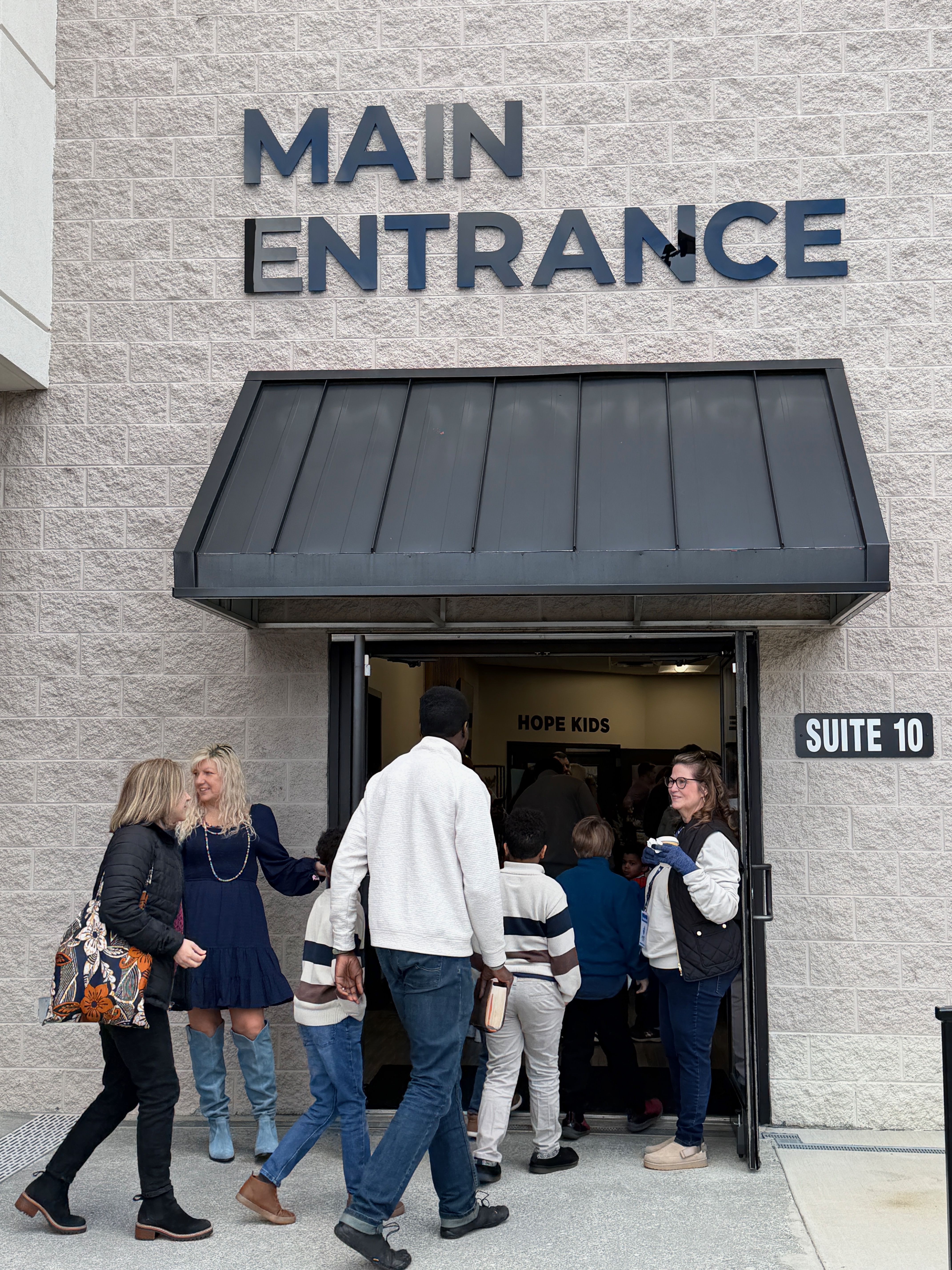 Hope Church families walking into the Main Entrance on a Sunday morning