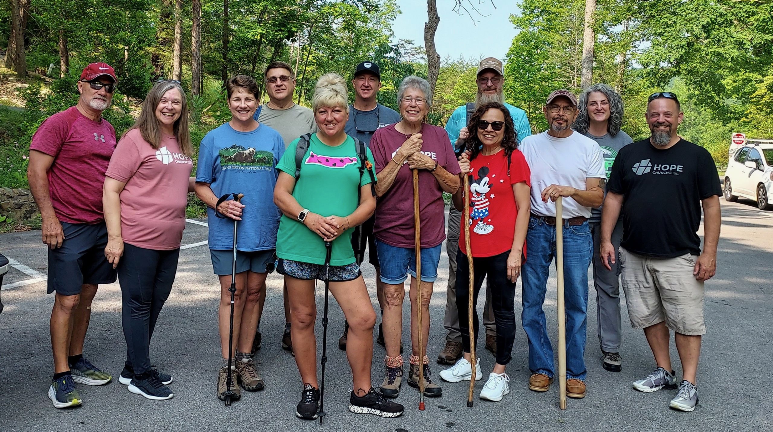 The Fueled by Hope group hiking together at Bays Mountain on a clear summer day